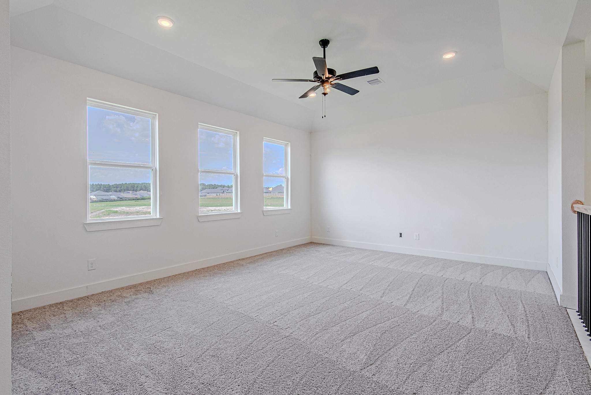 153 Peninsula Point Drive Montgomery, TX 77356 - Photo 32 of 46 Spacious secondary bedroom with ceiling fan and multiple windows