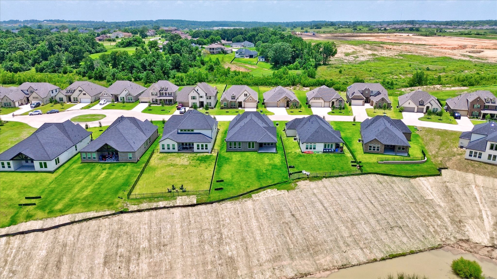 153 Peninsula Point Drive Montgomery, TX 77356 - Photo 41 of 46 Enjoy expansive backyard views with no rear neighbors. These homes back to a greenbelt and open drainage easement, offering a peaceful setting with extra privacy and space to unwind.