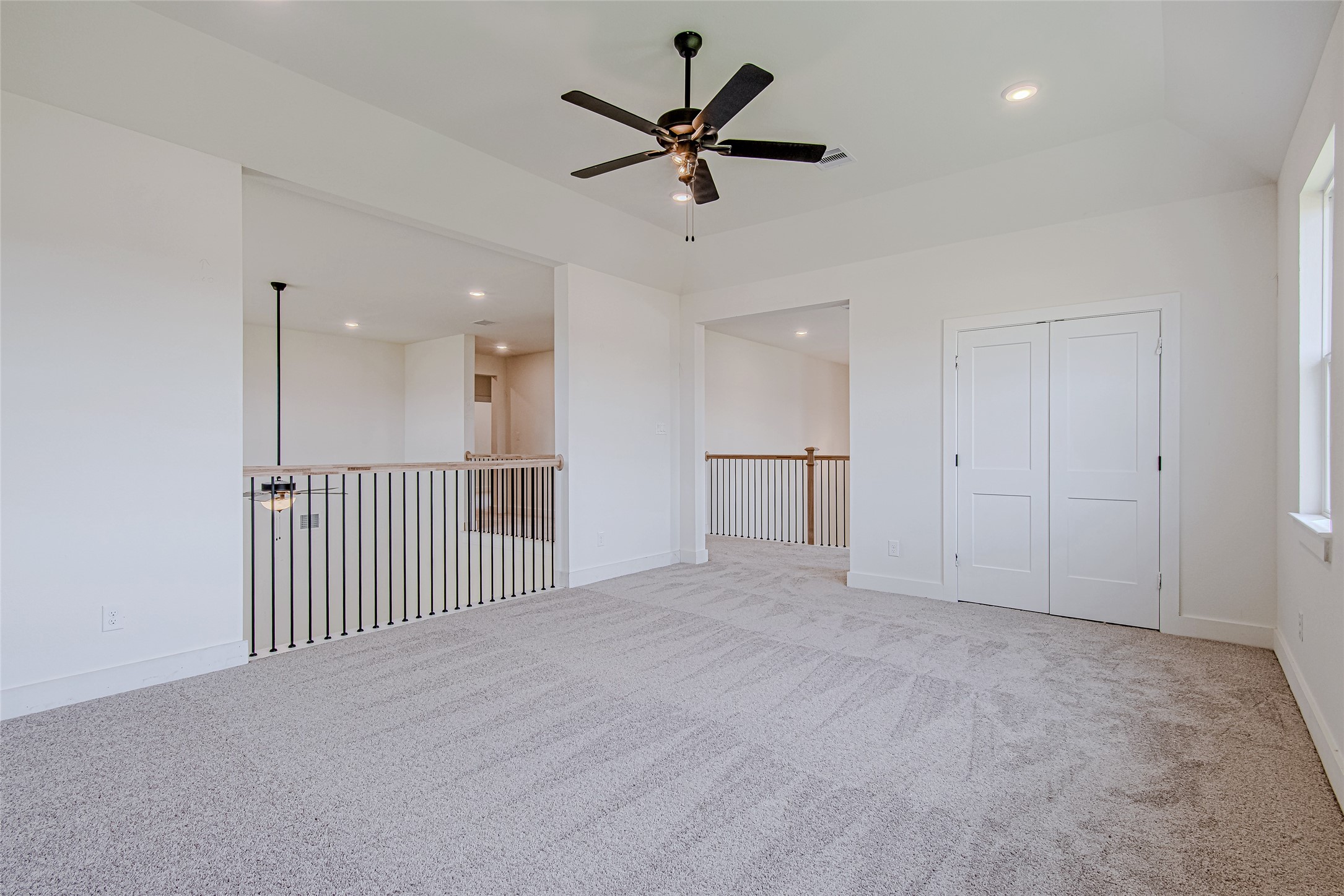 153 Peninsula Point Drive Montgomery, TX 77356 - Photo 4 of 46 A spacious living room featuring high ceilings, neutral tones, and abundant natural light