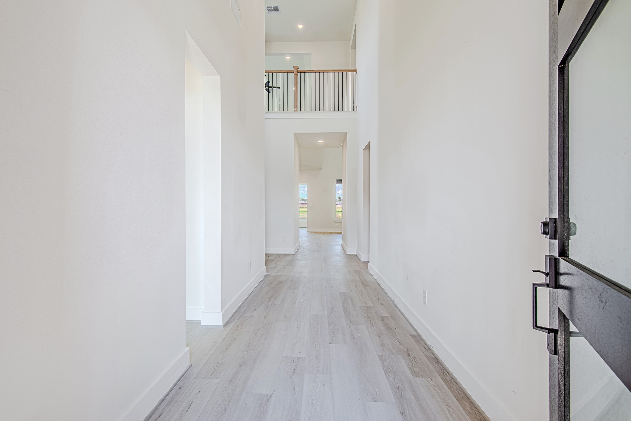 153 Peninsula Point Drive Montgomery, TX 77356 - Photo 5 of 46 Bright hallway leading to the heart of the home, offering clean lines and modern design