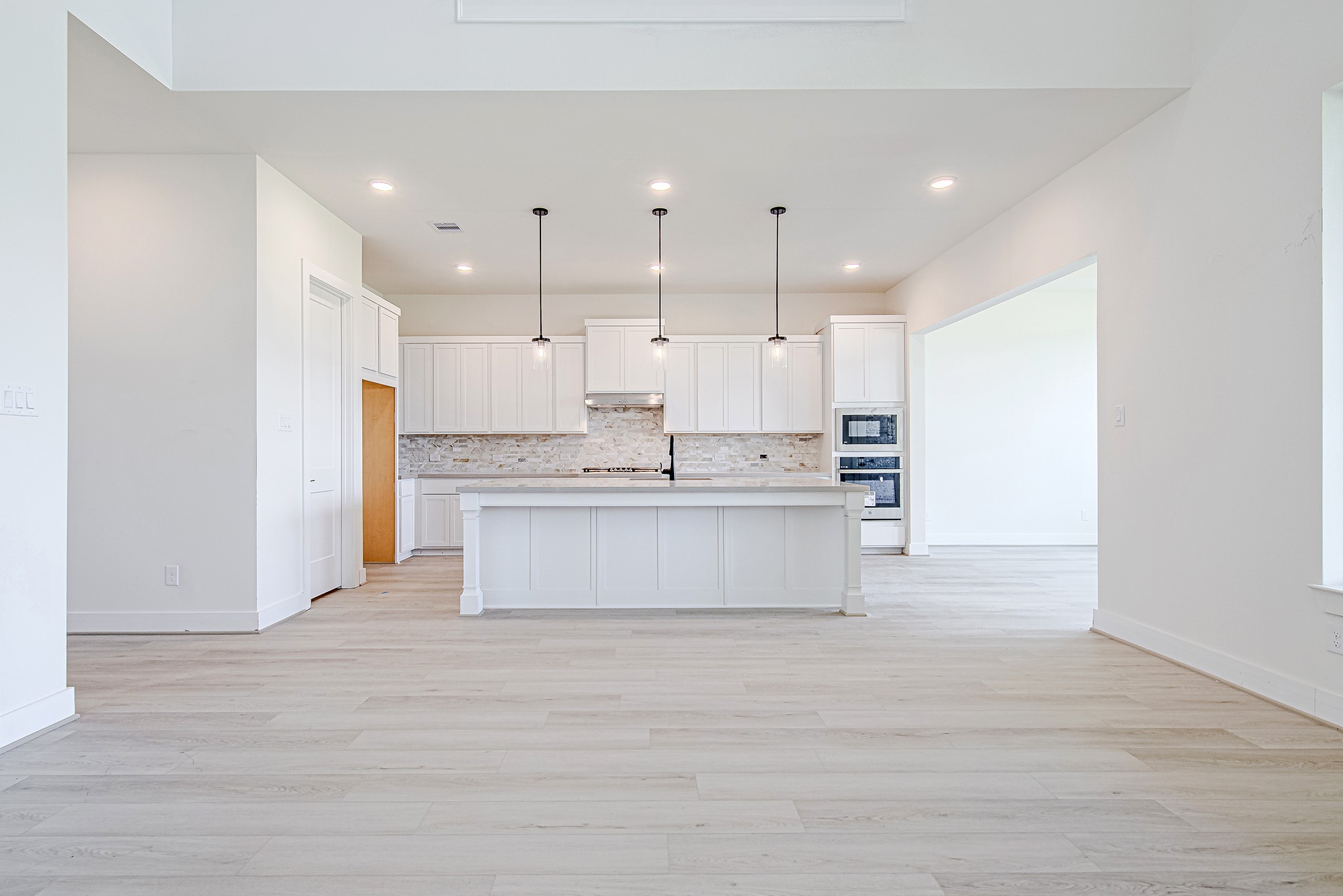 153 Peninsula Point Drive Montgomery, TX 77356 - Photo 8 of 46 Another view of the open kitchen showcasing seamless connectivity to the dining and living areas