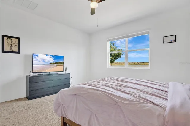 a bedroom with a bed and a cabinets