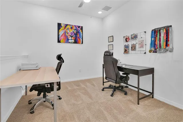 a view of a workspace with furniture