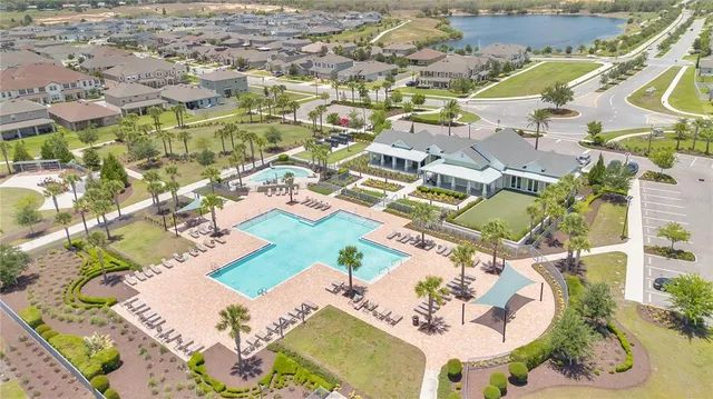 an aerial view of residential houses with outdoor space