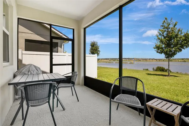 a view of a dining room with furniture and window