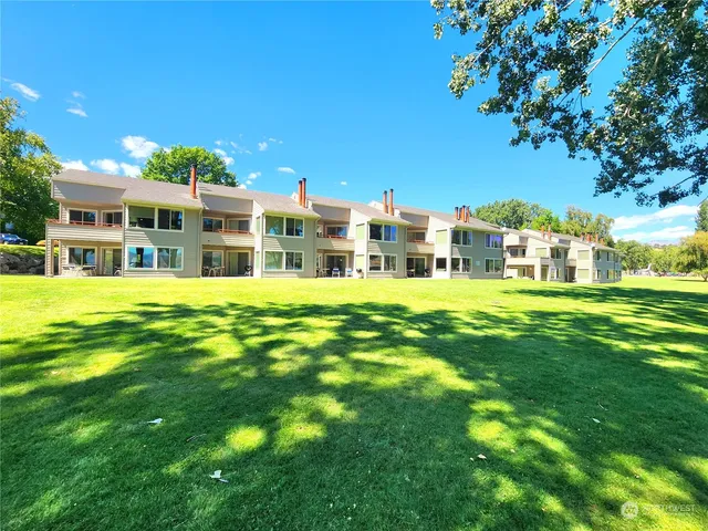 a view of a house with a big yard