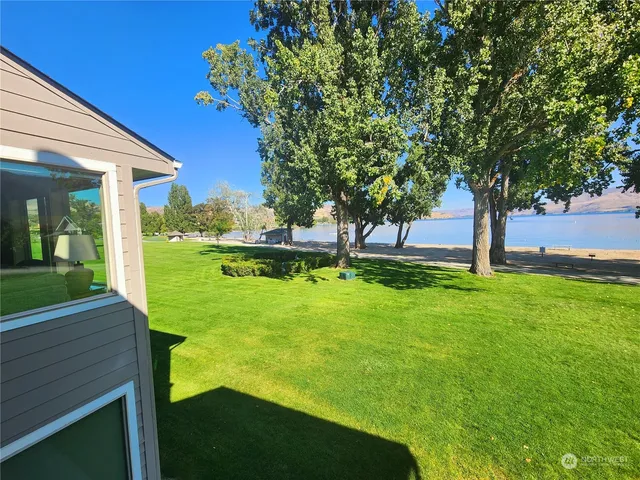 a view of an house with backyard space and garden
