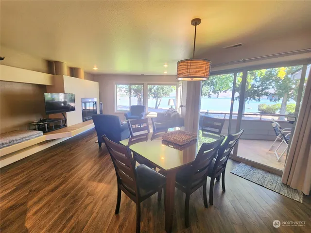 a dining room with furniture window wooden floor