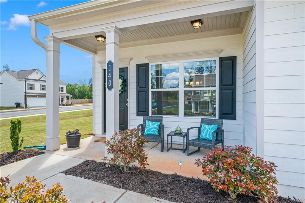 140 Kenneth Drive Dawsonville, GA 30534 - Photo 1 of 1 a front view of a house with outdoor seating