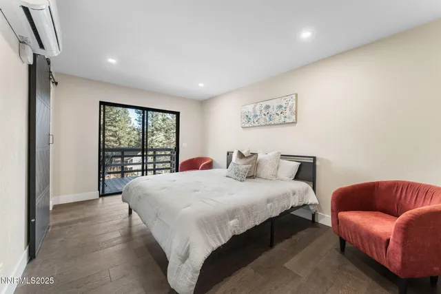 a bedroom with a bed window and couch