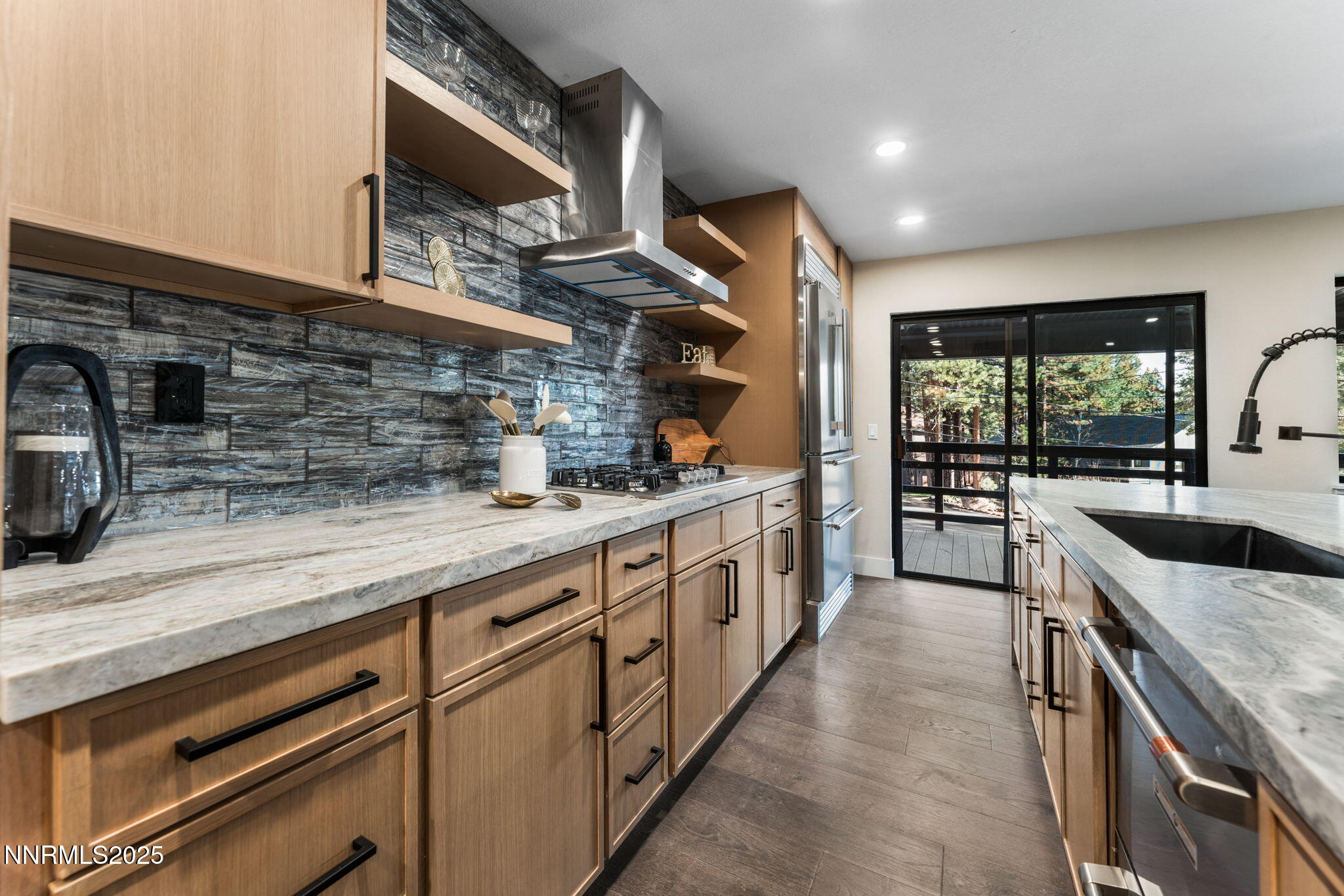 221 Lark Court, Unit 2 Incline Village, NV 89451 - Photo 3 of 33 a kitchen with stainless steel appliances granite countertop a sink and a stove