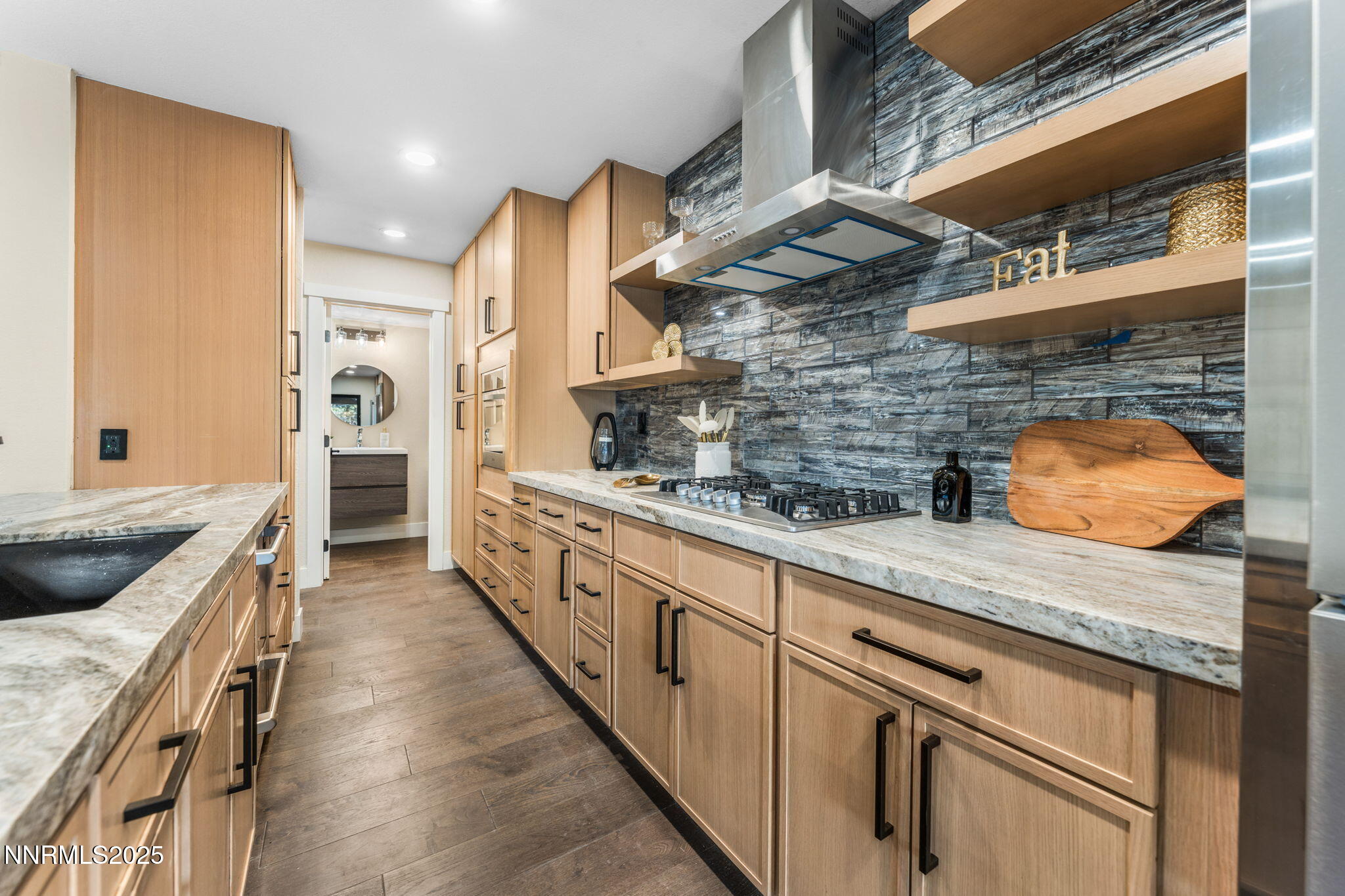 221 Lark Court, Unit 2 Incline Village, NV 89451 - Photo 5 of 33 a kitchen with stainless steel appliances granite countertop a sink and stove