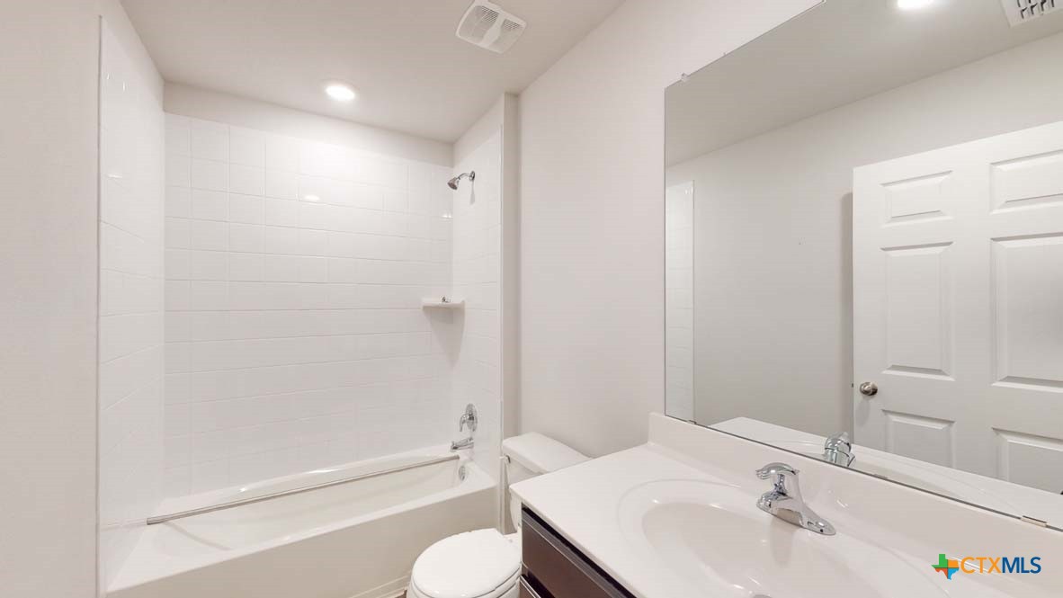 553 Hector Loop Georgetown, TX 78626 - Photo 19 of 21 a bathroom with a sink toilet and shower