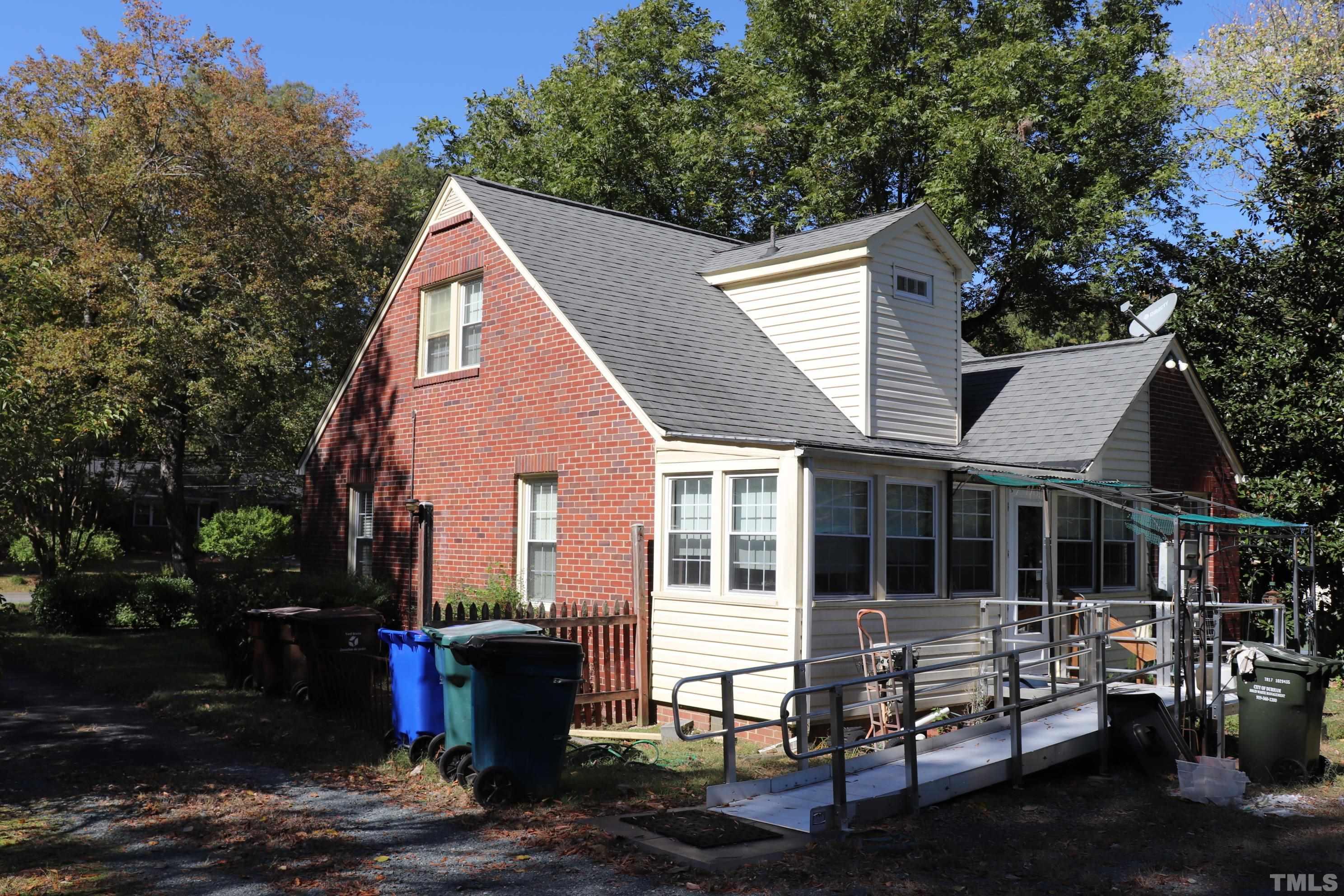 3103 Dixon Road Durham, NC 27707 - Photo 4 of 6 a view of a house with a yard and sitting area