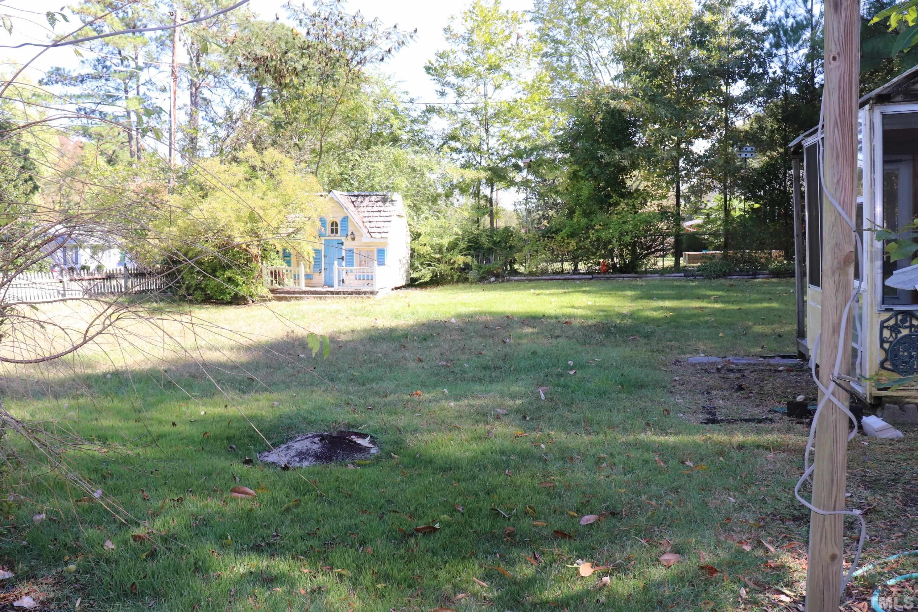 3103 Dixon Road Durham, NC 27707 - Photo 5 of 6 a backyard of a house with lots of green space