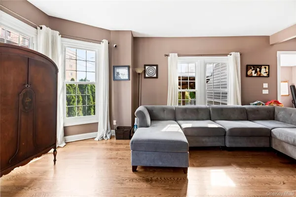 a living room with furniture and windows