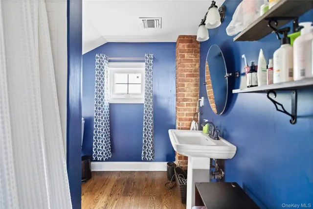 a bathroom with a sink a mirror and a bathtub