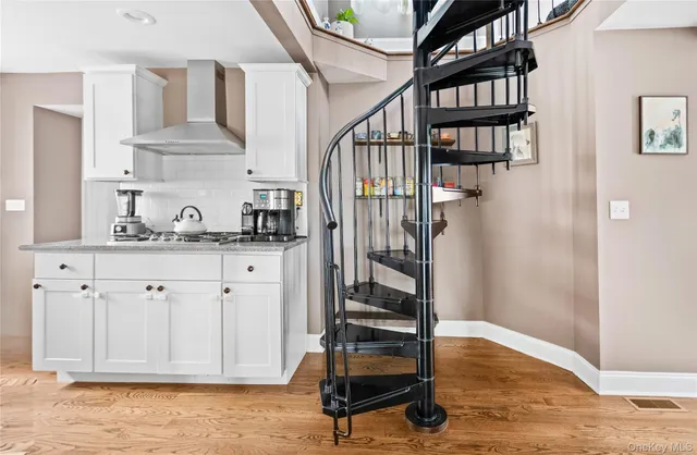 a view of entryway with workspace and stairs