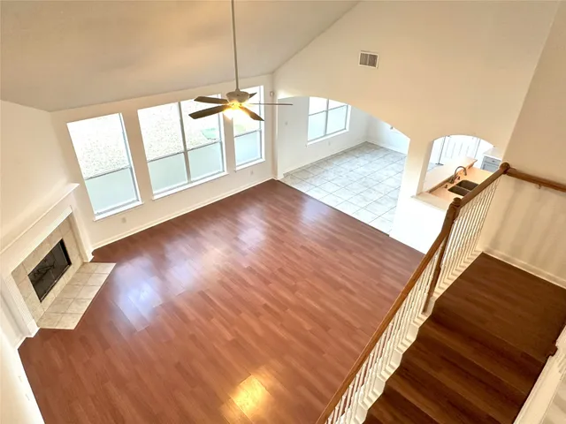 a spacious bathroom with a bathtub shower and sink