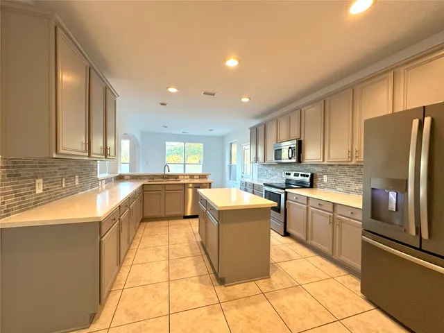 a bathroom with a double vanity sink and mirror