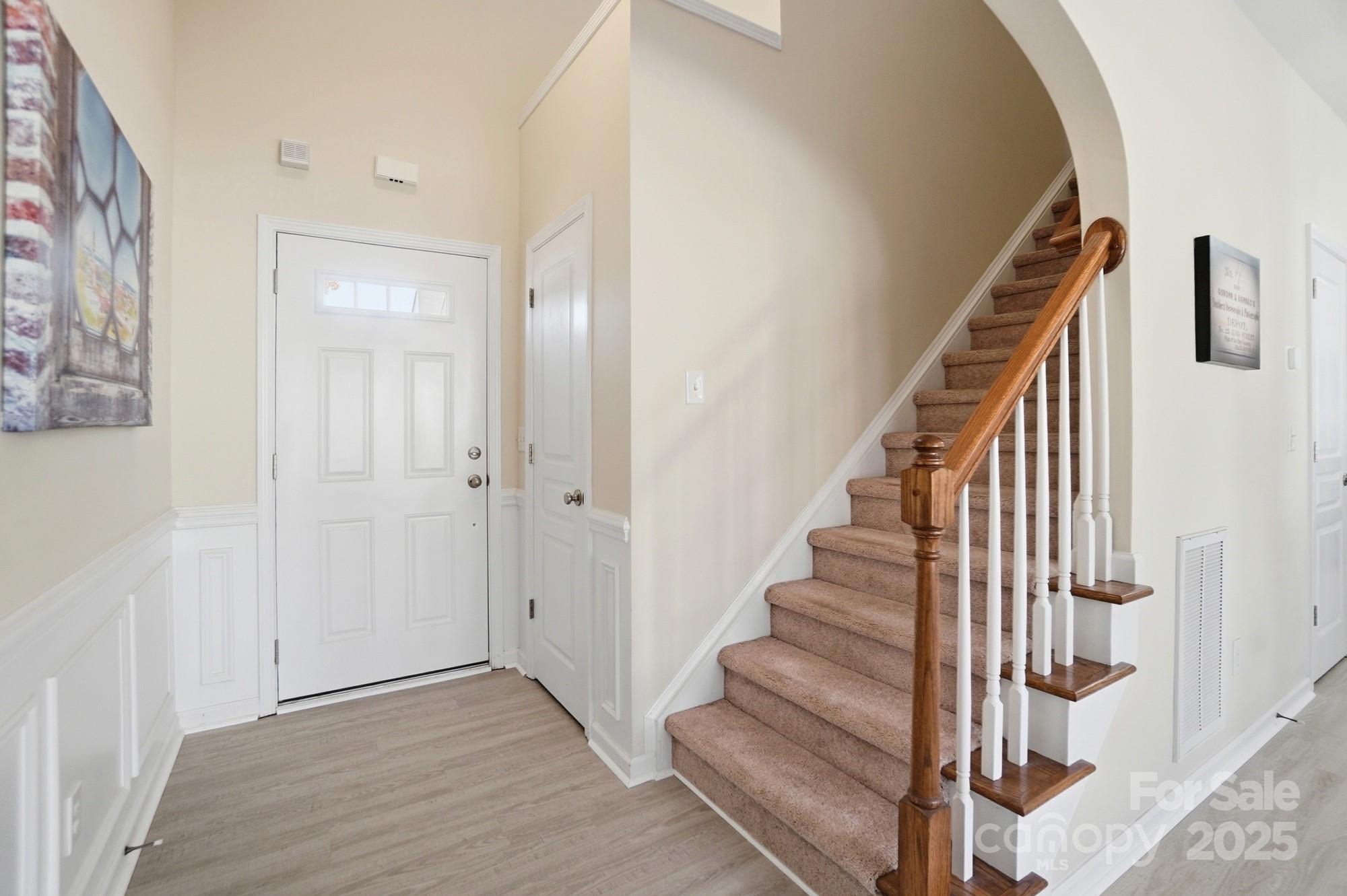 224 Sand Paver Way Fort Mill, SC 29708 - Photo 20 of 42 a view of entryway with wooden floor and stairs