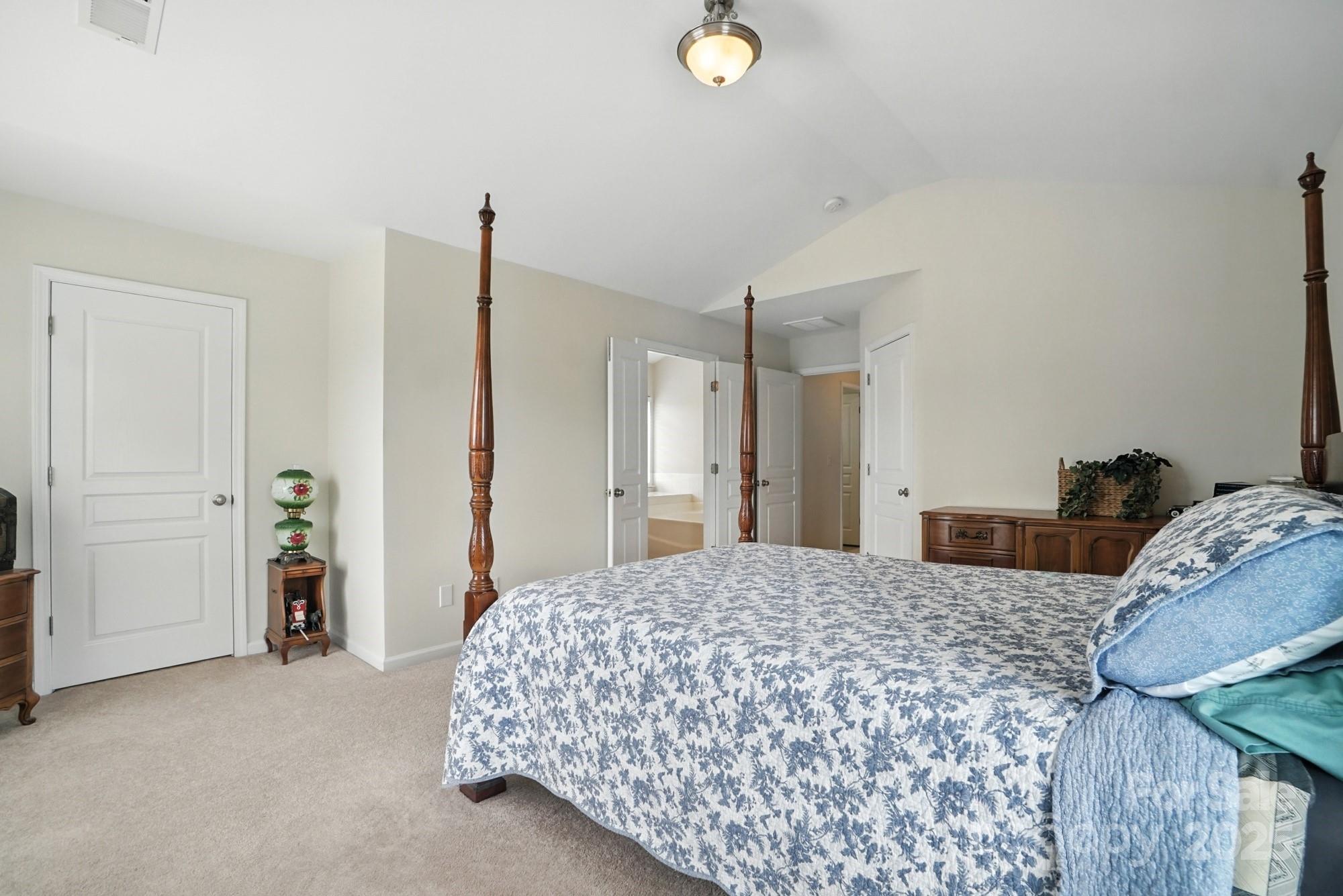 224 Sand Paver Way Fort Mill, SC 29708 - Photo 23 of 42 a bedroom with a bed and a cabinets