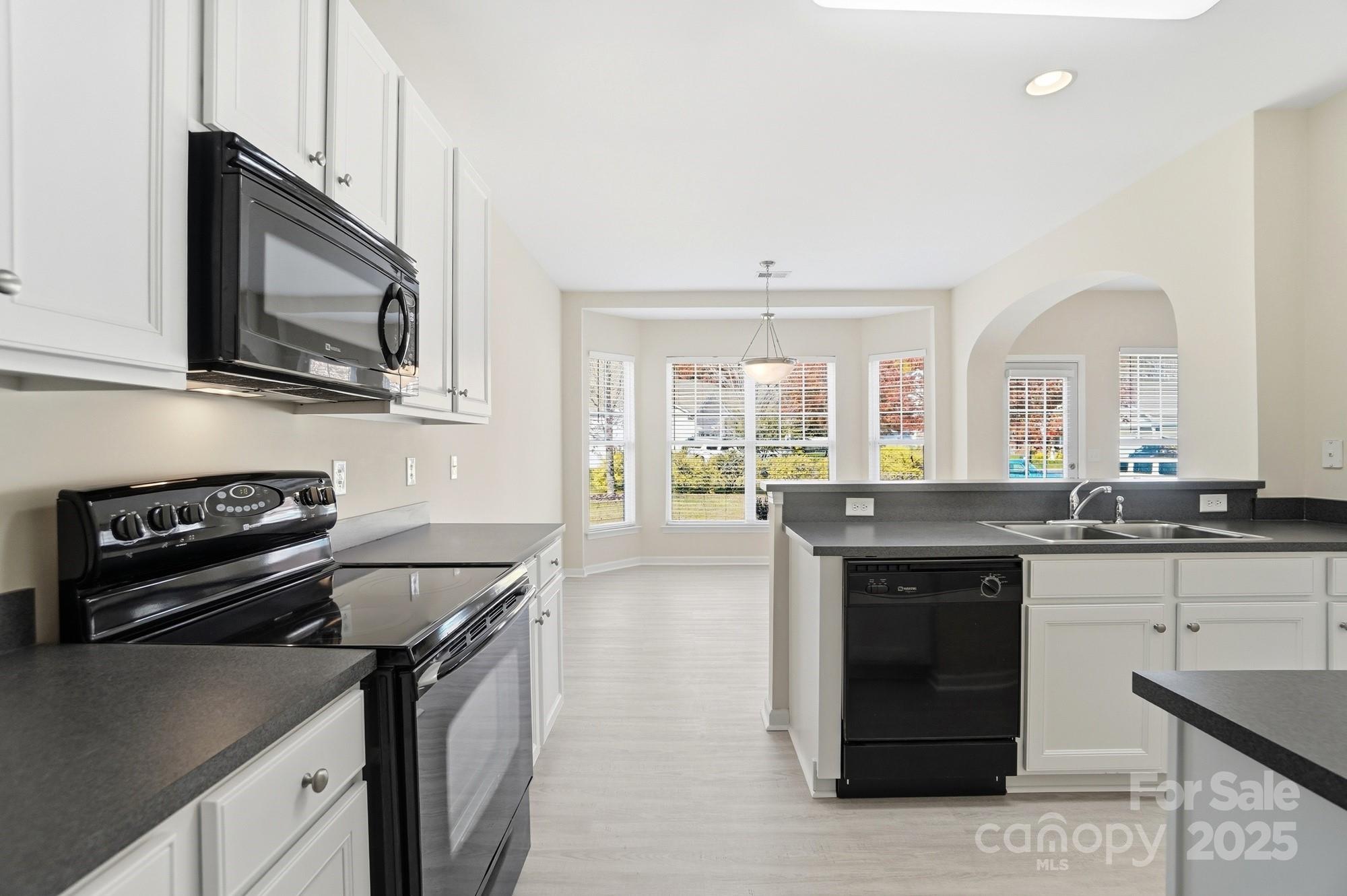 224 Sand Paver Way Fort Mill, SC 29708 - Photo 3 of 42 a kitchen with a stove and a microwave
