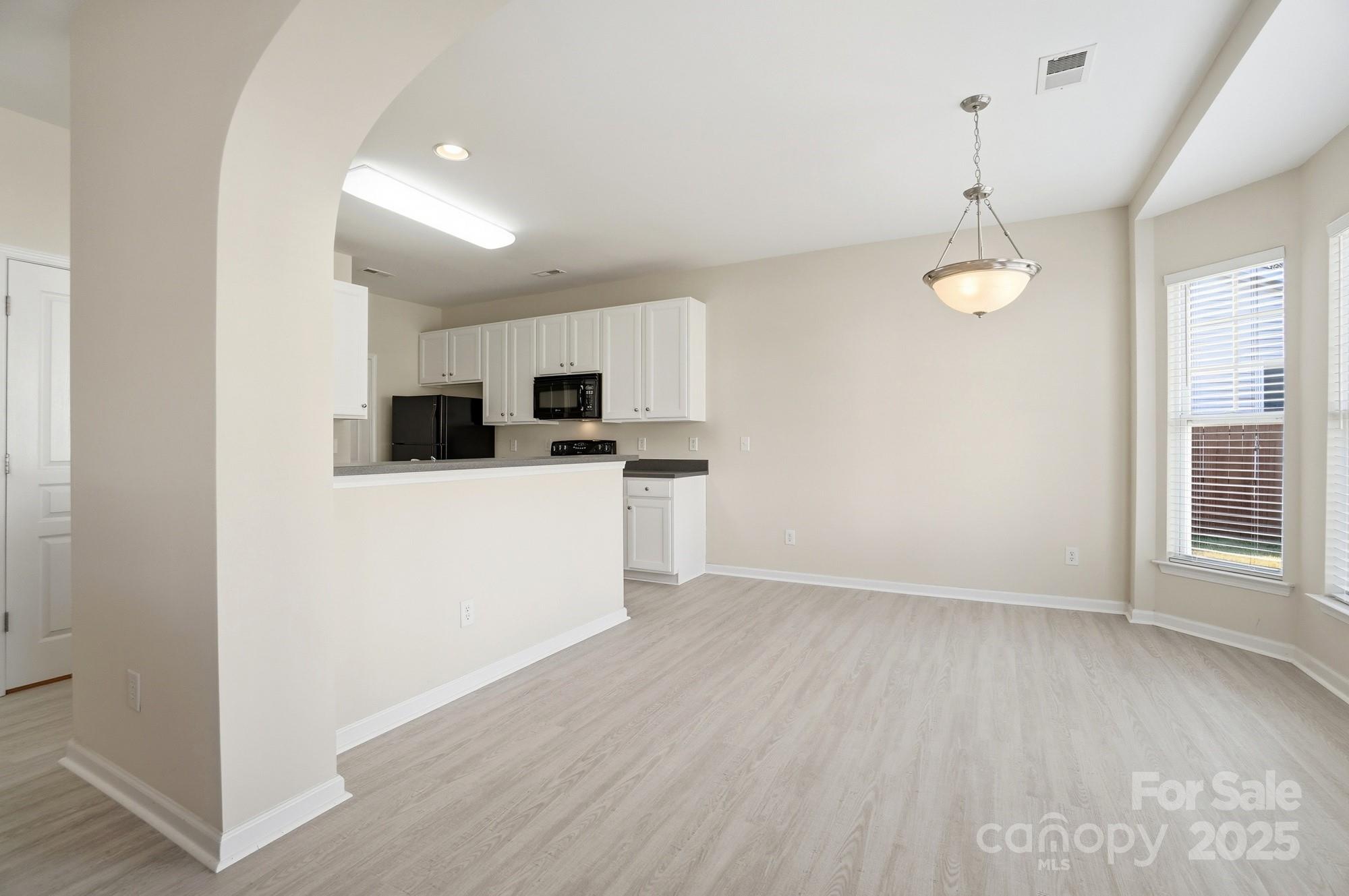 224 Sand Paver Way Fort Mill, SC 29708 - Photo 8 of 42 a view of a kitchen with microwave and cabinets