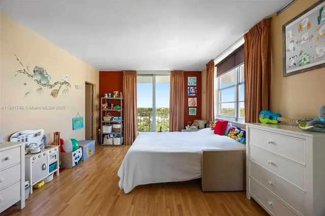 a bathroom with a granite countertop sink a mirror and a bathtub