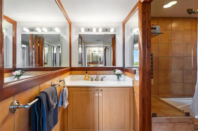 a bathroom with a toilet a sink and a mirror