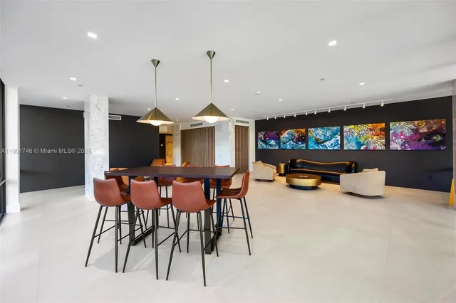 a view of a livingroom with workspace and a couch