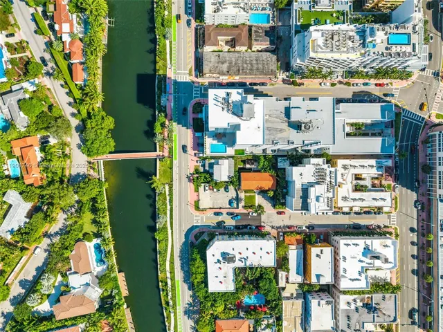 a kitchen with refrigerator and cabinets