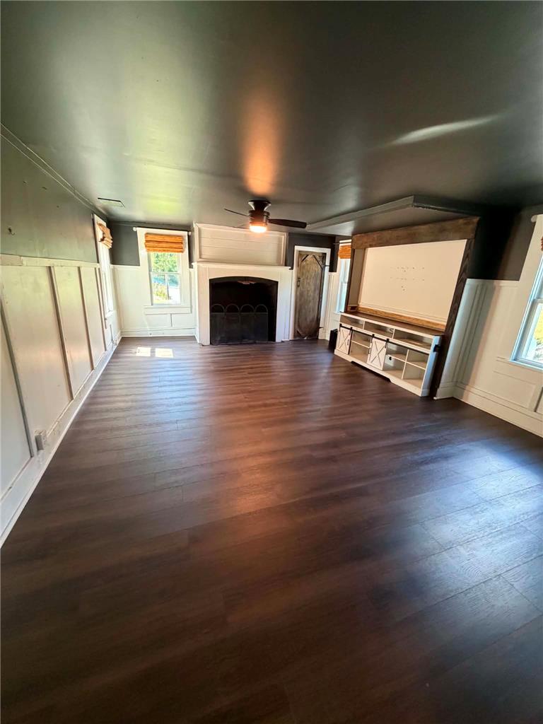 164 Sand Spring Road Cresco, PA 18326 - Photo 38 of 60 Rich dark wood flooring extends through this inviting living space, centered by a charming fireplace.