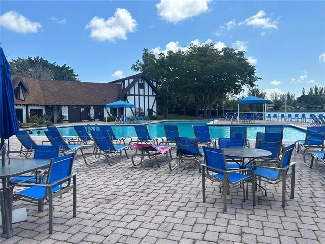 a view of a chairs and table in patio