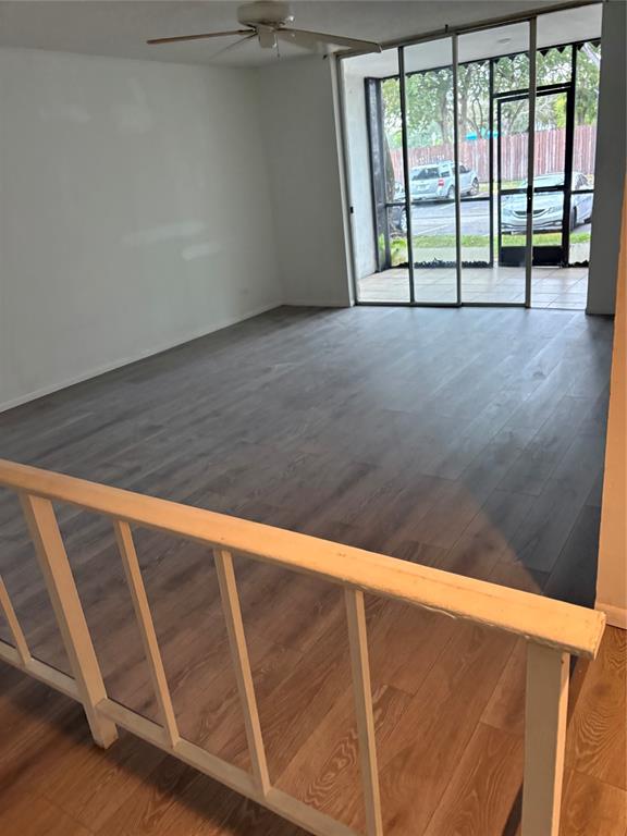 3710 Inverrary Drive, Unit 1Y Lauderhill, FL 33319 - Photo 4 of 17 a view of an empty room with wooden floor and a window