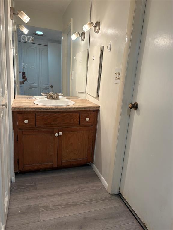 3710 Inverrary Drive, Unit 1Y Lauderhill, FL 33319 - Photo 10 of 17 a bathroom with a sink vanity and mirror