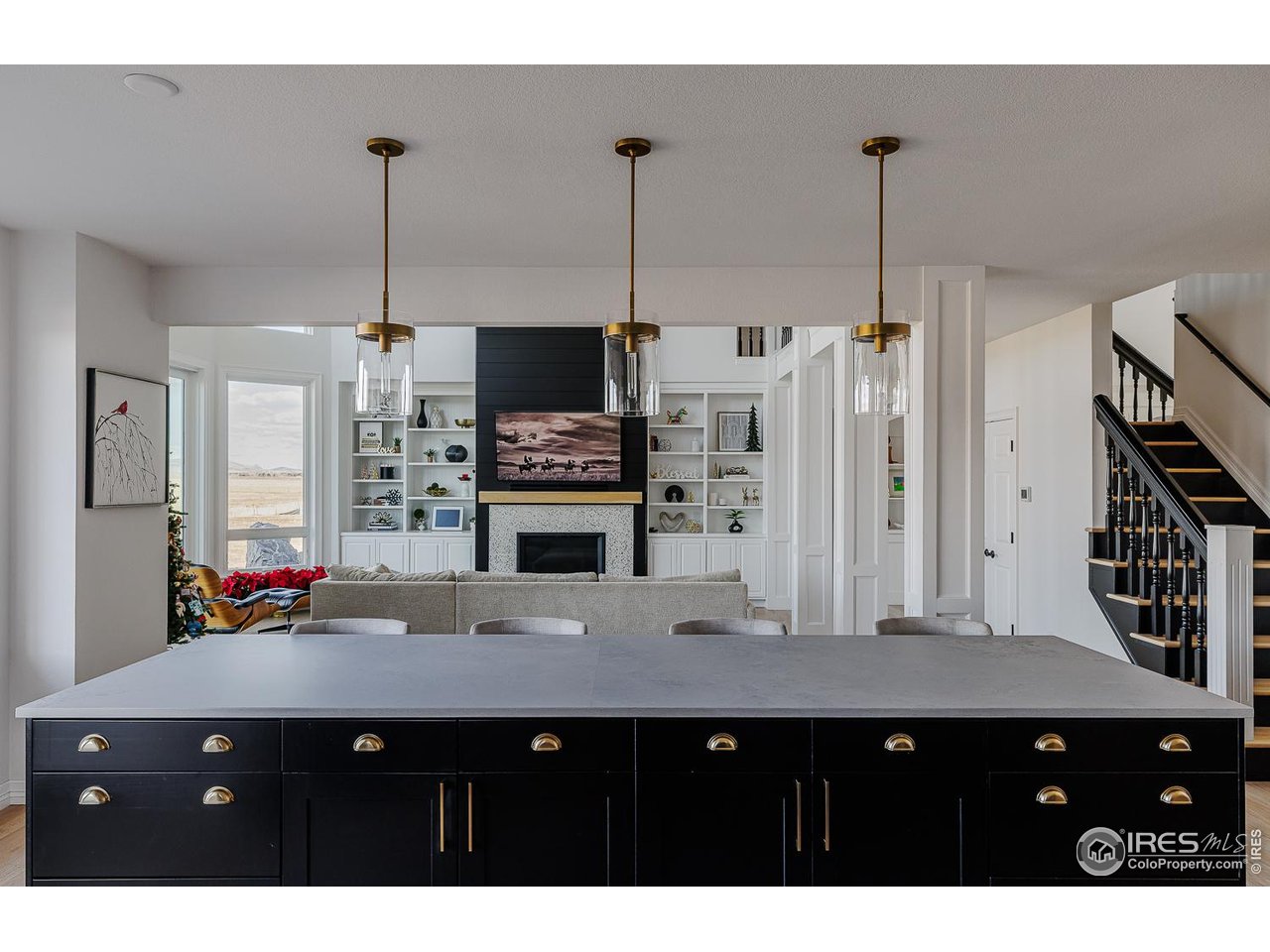 7401 Deerfield Road Longmont, CO 80503 - Photo 10 of 49 Massive kitchen island overlooking family room