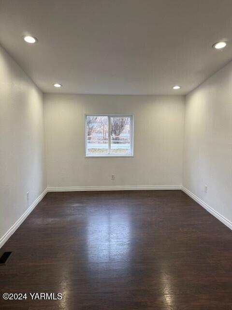 290 Outlook Road Outlook, WA 98938 - Photo 6 of 11 an empty room with wooden floor and windows