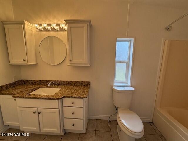 290 Outlook Road Outlook, WA 98938 - Photo 8 of 11 a bathroom with a granite countertop toilet sink and mirror
