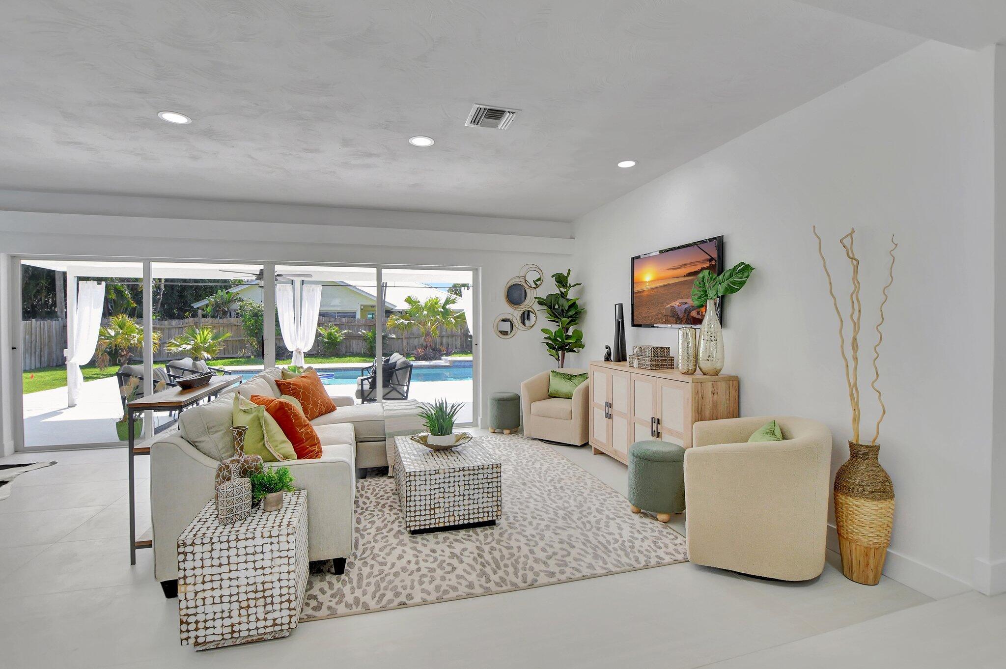 832 Southwest 10th Avenue Boca Raton, FL 33486 - Photo 13 of 57 a living room with furniture and a large window