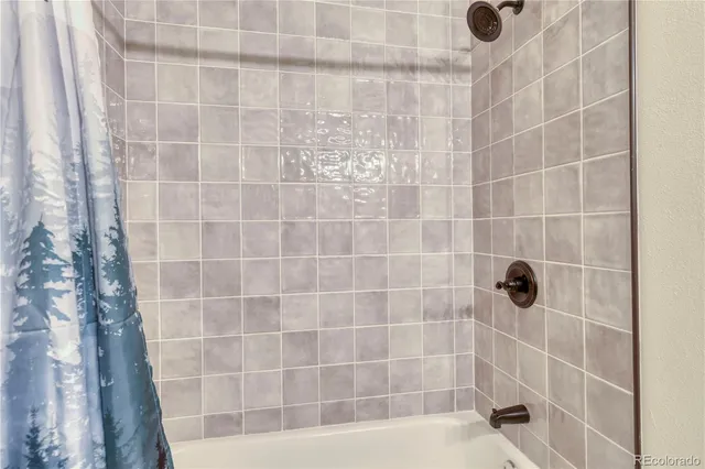 a spacious bedroom with a bed and a window