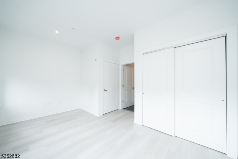 12 River Road, Unit 303 Fair Lawn, NJ 07410 - Photo 15 of 16 a very nice looking room with a ceiling fan