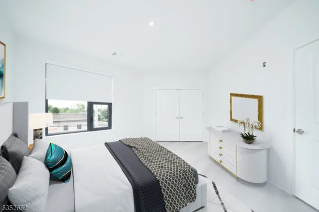 a bedroom with a bed and window