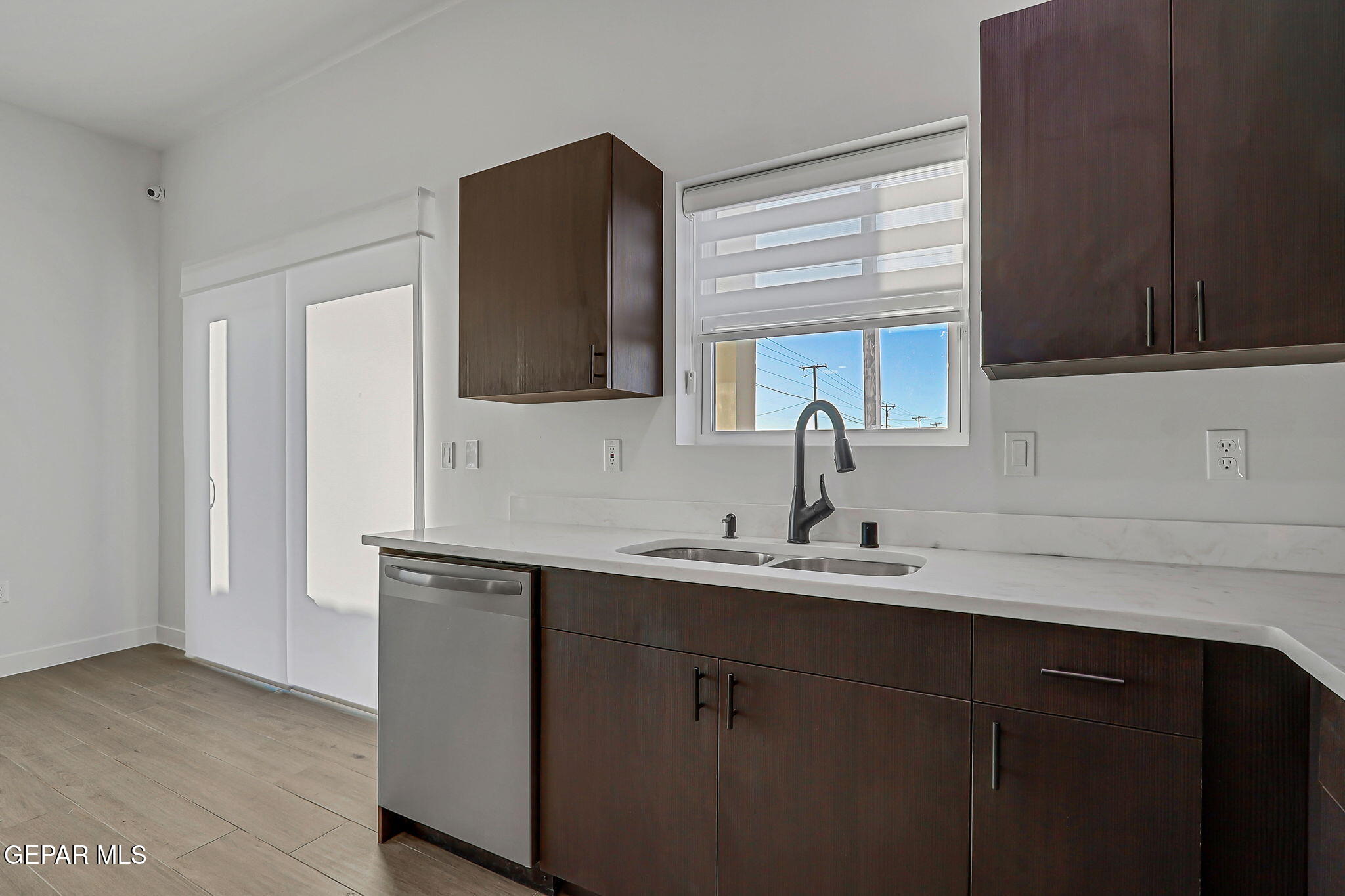 5981 Ruidoso Downs Street El Paso, TX 79932 - Photo 11 of 35 a kitchen with a sink and cabinets