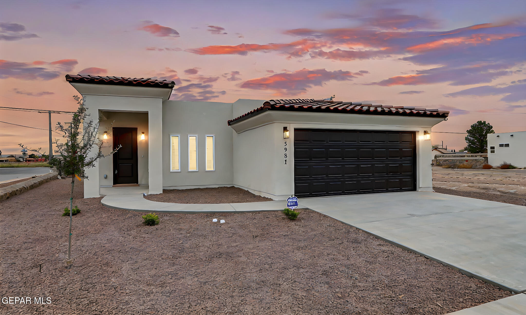 5981 Ruidoso Downs Street El Paso, TX 79932 - Photo 2 of 35 front view of a house with a garage