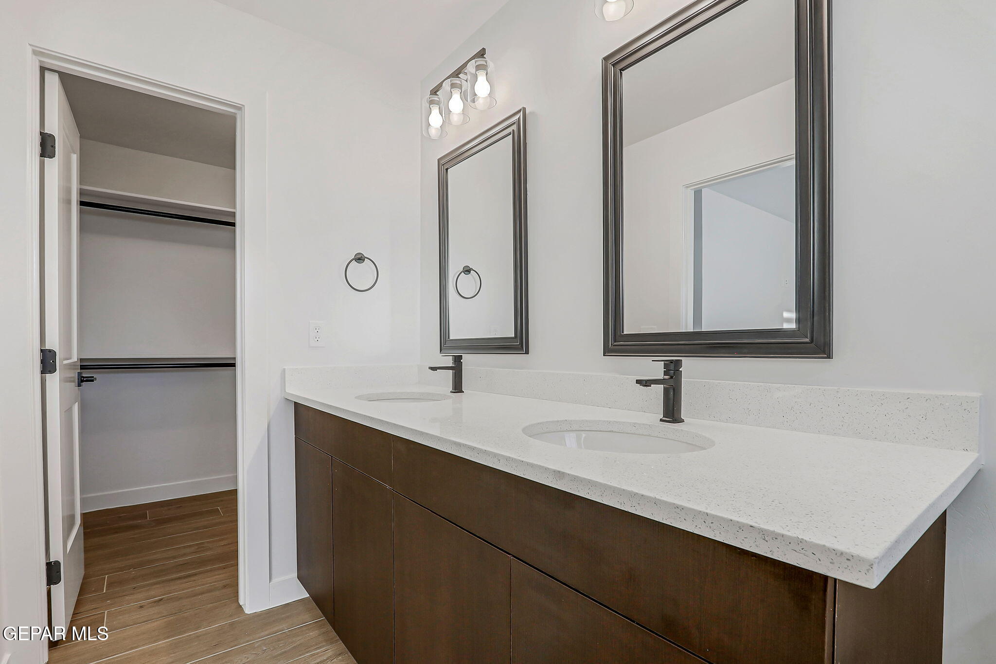 5981 Ruidoso Downs Street El Paso, TX 79932 - Photo 21 of 35 a bathroom with a sink and a mirror