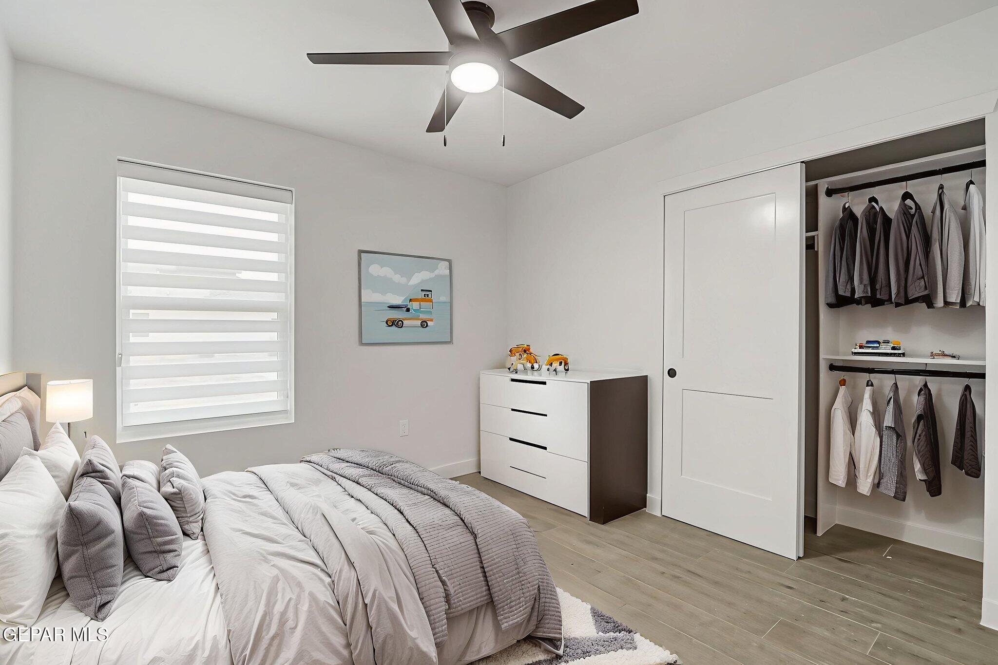 5981 Ruidoso Downs Street El Paso, TX 79932 - Photo 27 of 35 a bedroom with a bed and a ceiling fan