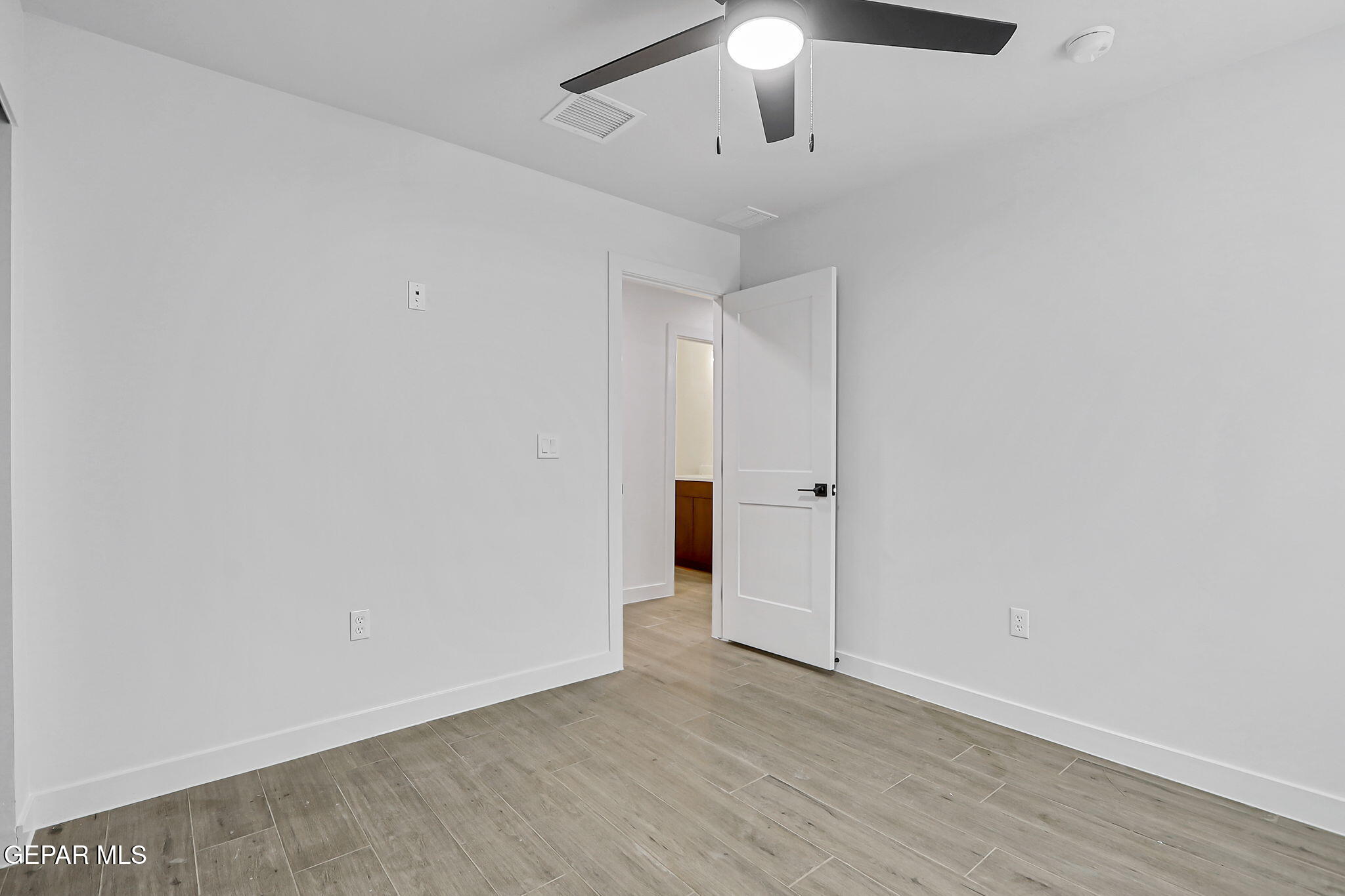 5981 Ruidoso Downs Street El Paso, TX 79932 - Photo 28 of 35 wooden floor in an empty room