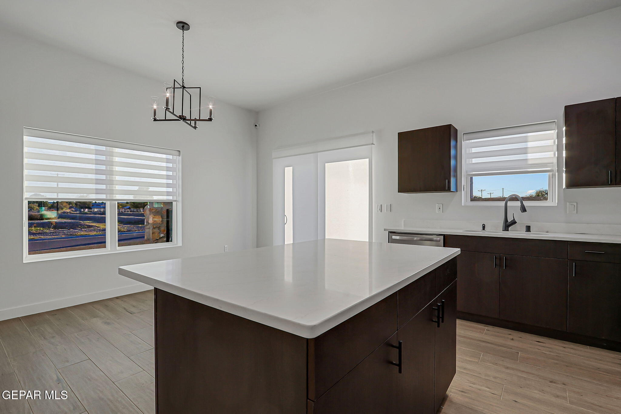 5981 Ruidoso Downs Street El Paso, TX 79932 - Photo 10 of 35 a kitchen with a center island appliances and cabinets