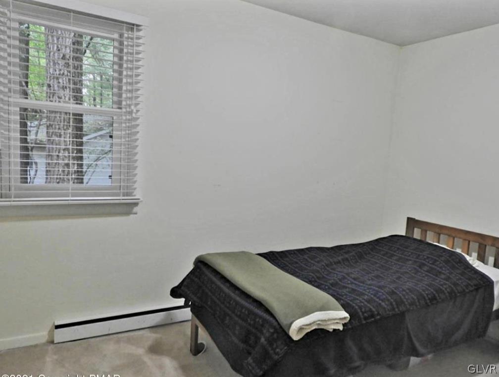 3110 Fern Road Pocono Summit, PA 18346 - Photo 12 of 20 a bedroom with a bed and a window